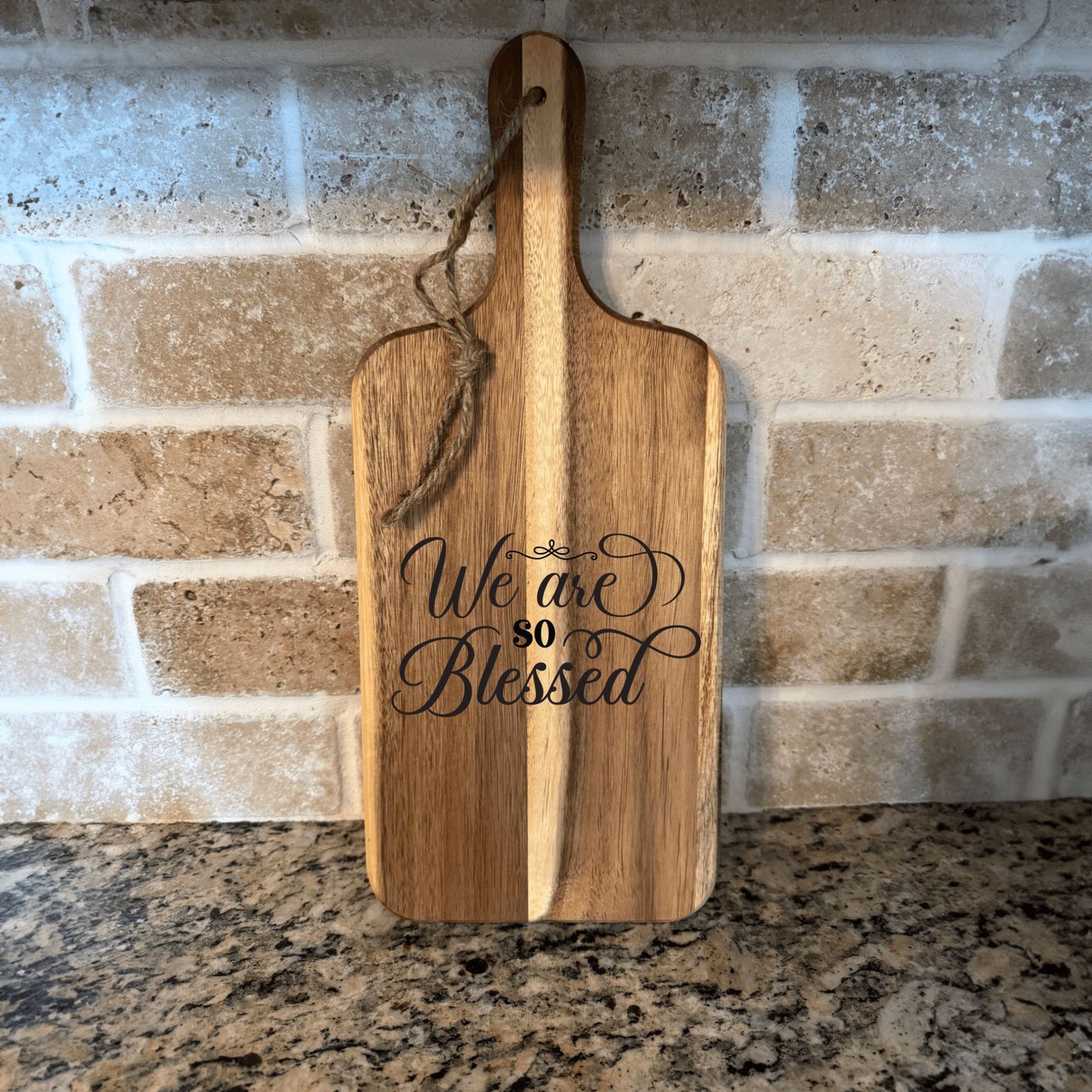 17"x7" Acacia wood cutting board with handle